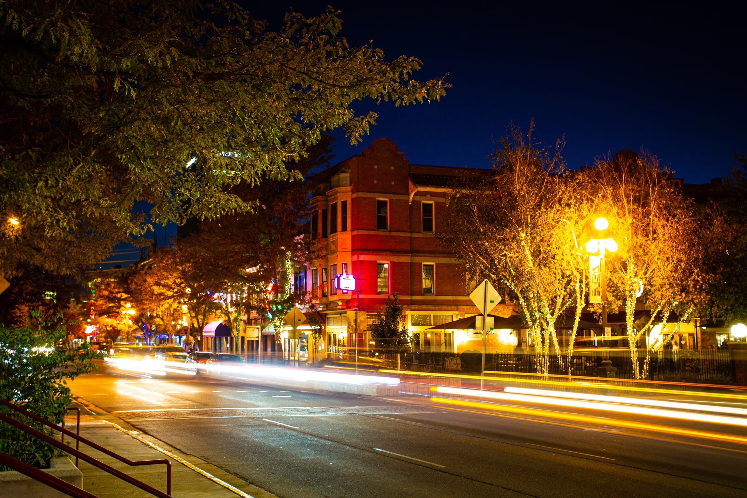 REX building illuminated at night in downtown Billings